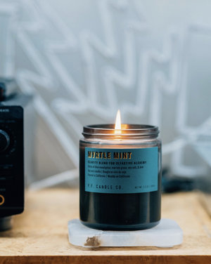 FROM THE BRAND NEW ALCHEMY LINE – A collection of candles and incense cones in scents meant to mimic the healing properties of nature and boost your mood. Our 7.2 oz Alchemy Standard Candles are hand-poured and feature smoke-colored glass vessels, black metal lids, and gold-leafed labels inspired by vintage window lettering
