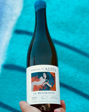 100% Garnaxta Blanca. Catalonia, Spain.  Woman winemaker - Nuria Altes. All natural. Flower power. White peach crunch. Fleshy and spicy like a saucy Flamenco dancer after 2 glasses of this! Juicy green melons. Rocky minerals. Oily and slick like a tropical beach bod. Dry and vibrant.