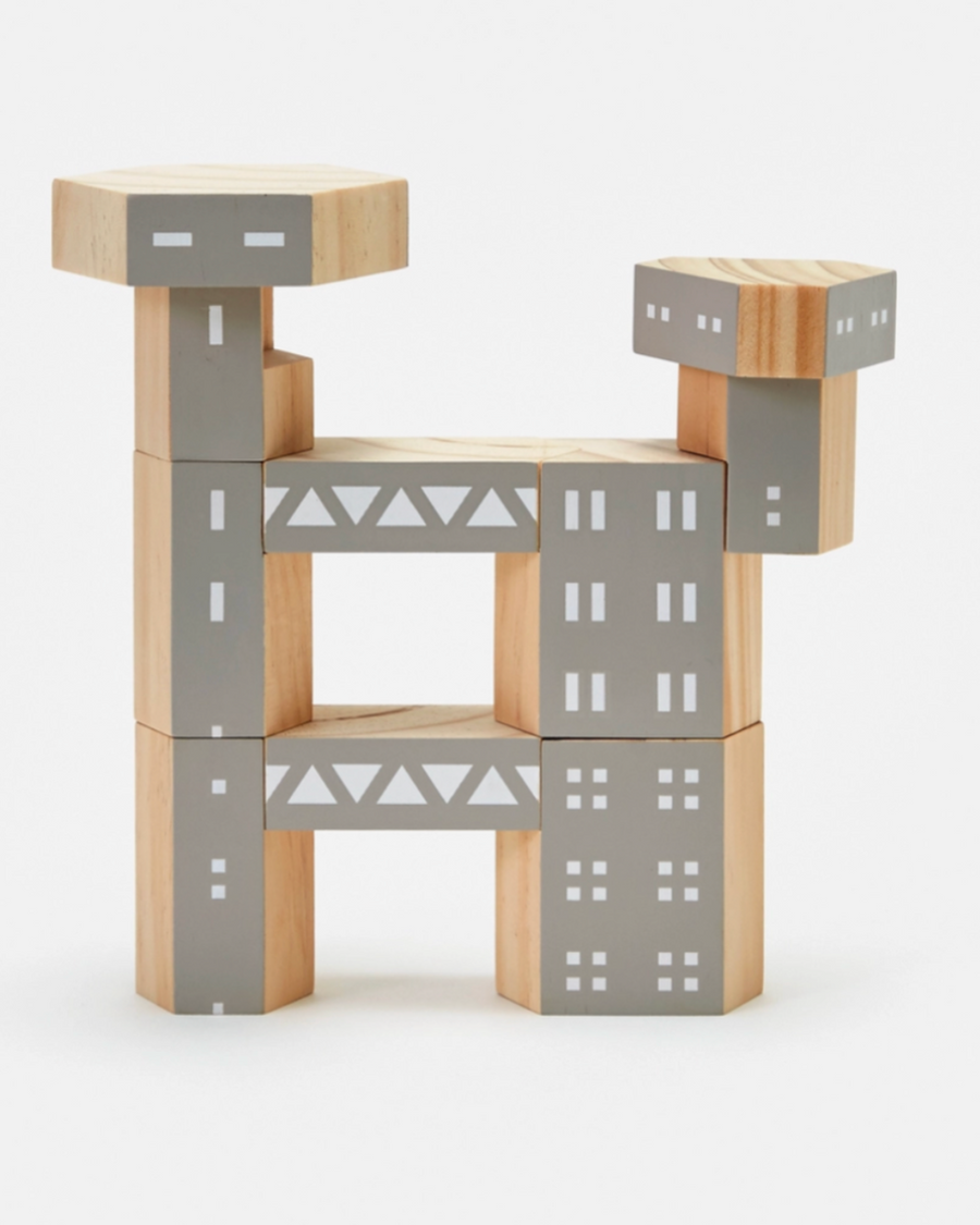 Wooden building blocks with gray and beige design on a white background