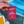 Red packet labeled 'Apéritif' held by a hand with a blurred background
