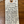 Handwritten label on a wooden surface with product details.