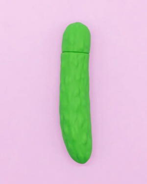 Green cylindrical object on a light purple background