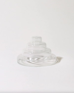 Clear glass saucer on a white background