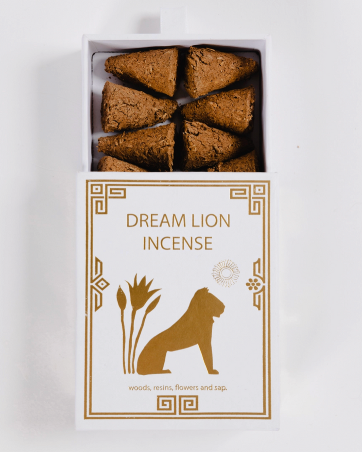 Box of Dream Lion Incense with incense cones on a white background