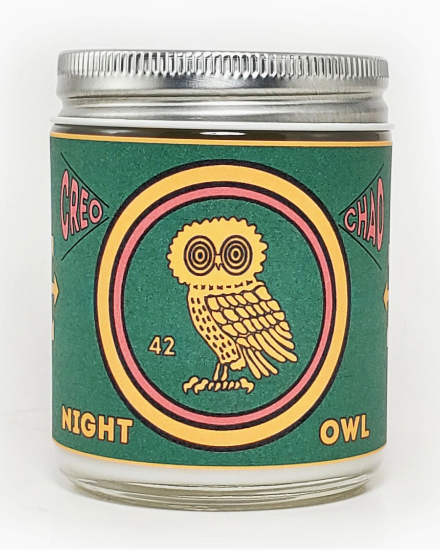 Jar with a decorative label featuring an owl design on a white background