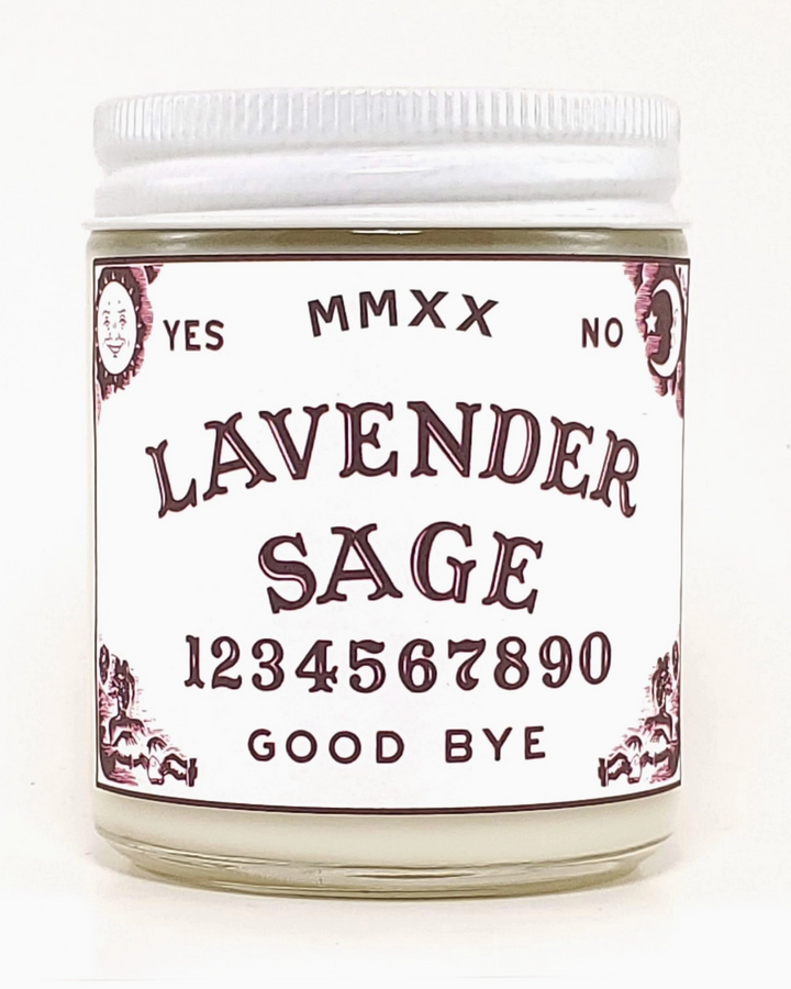 Jar of lavender sage candle with a decorative label on a white background