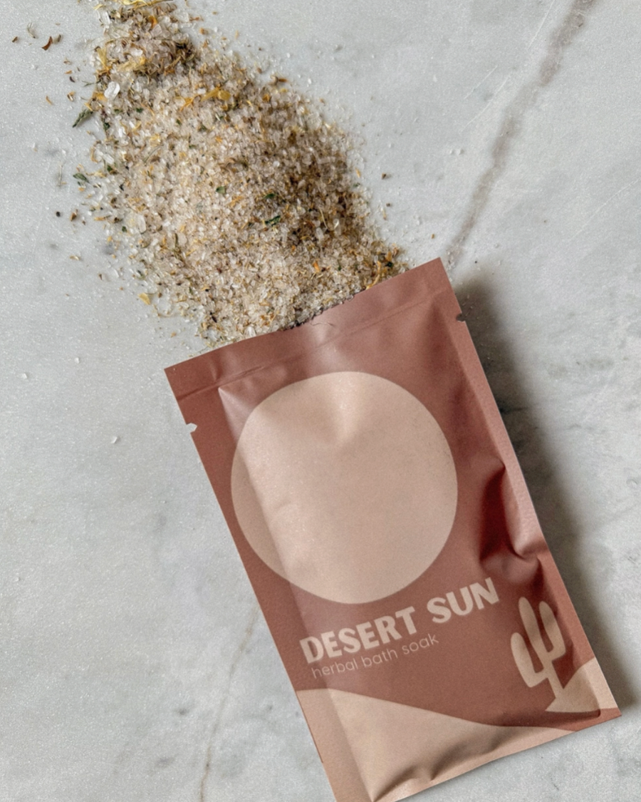Desert Sun herbal bath soak packaging on a textured surface