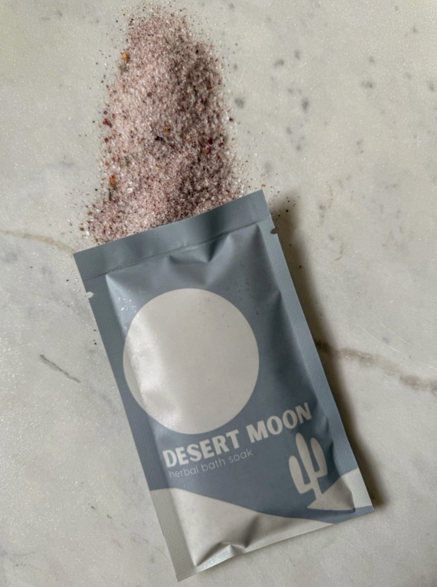 Desert Moon herbal bath soak packaging on a textured surface
