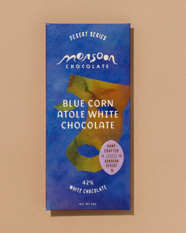 Monsoon Chocolate Blue Corn Atole White Chocolate bar packaging on a beige background