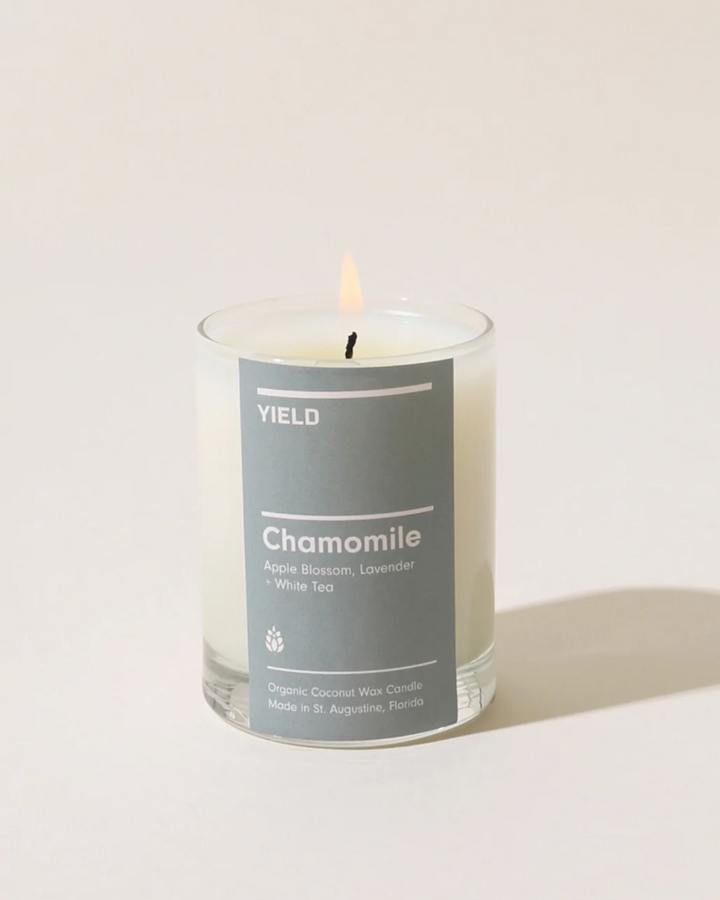 Candle with a gray label on a white background