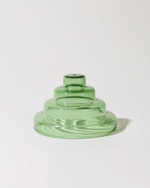 Green glass vase on a white background