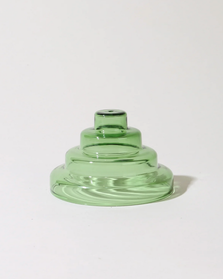 Green glass vase on a white background