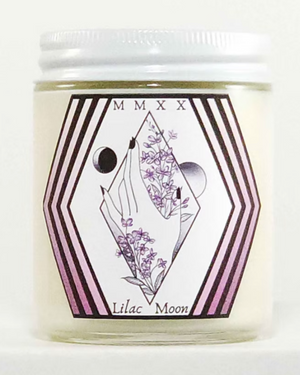 Candle jar with 'Lilac Moon' label featuring geometric design and floral elements on a white background.