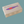 Box with a purple fish logo on a beige background