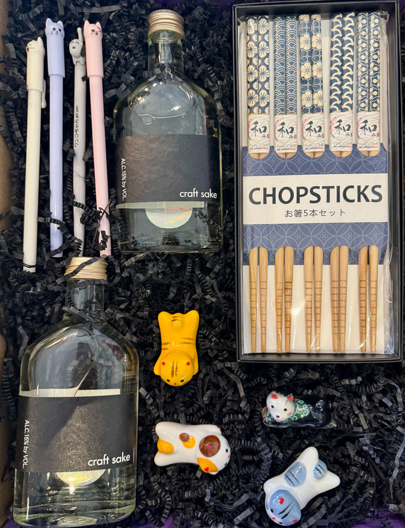 Our Sake To Me Box includes:

2 bottles of Craft Sake, 4 gel pens (assorted), 4 Porcelain Pet Chopsticks Rests (assorted), 5-piece Chopsticks set.

*Substitutions of similar items may be made if products shown in this box are sold out at the time of ordering.