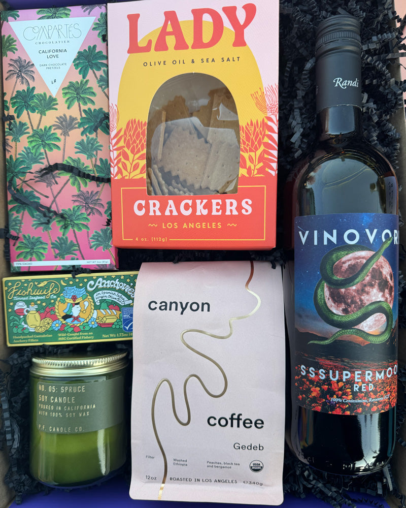 Our Local Love - Sssupermoon Box includes:

Vinovore Sssupermoon 100% Centesimino, Ravenna IGT, Compartés California Love Dark Chocolate Salted Pretzel Bar, Fishwife Anchovies in Spanish EVOO, P.F. Spruce Jar Candle, Gedeb Canyon Coffee, and Lady Larder Lady Crackers