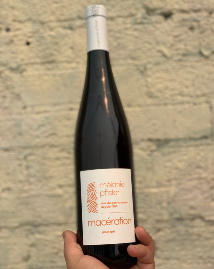 100% Pinot Gris Alsace, France.  Woman winemaker - Mélanie Pfister. All natural. Orange wine. 15 days on skins. Yellow cherries. Rhubarb + sage. Apricots + peach sunsets on a nude beach. Wild strawberries.
