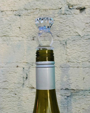Assorted acrylic wine stoppers. Pick your faves! Bling ring in blue or clear, green palm tree or cactus, orange sun. Sold individually.