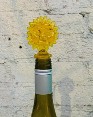 Assorted acrylic wine stoppers. Pick your faves! Bling ring in blue or clear, green palm tree or cactus, orange sun. Sold individually.