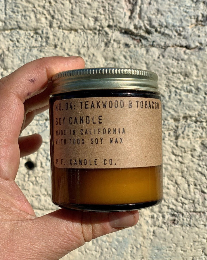These candles are simple: they're made with 100% domestically grown soy wax, fine fragrance oils, and cotton-core wicks. The fragrances are paraben-free, phthalate-free, and never (ever) tested on animals.  Teakwood & Tobacco. The one that started it all. Some call it the boyfriend scent, we call it the O.G. Notes of leather, teak, and orange. Size: 3.5 oz. 20-25 hr burn time.