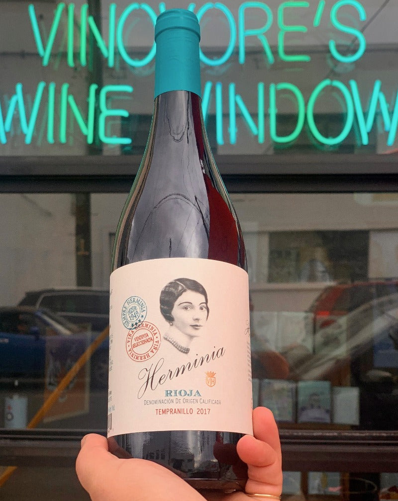 100% Tempranillo Rioja, Spain.  Woman in wine - Maria Herminia. 100 cases only! Fresh + fiesty. Fleshy fruit. Jolly spice + vanilla essence for the Holiday all days. Like a warm hug for your tongue.