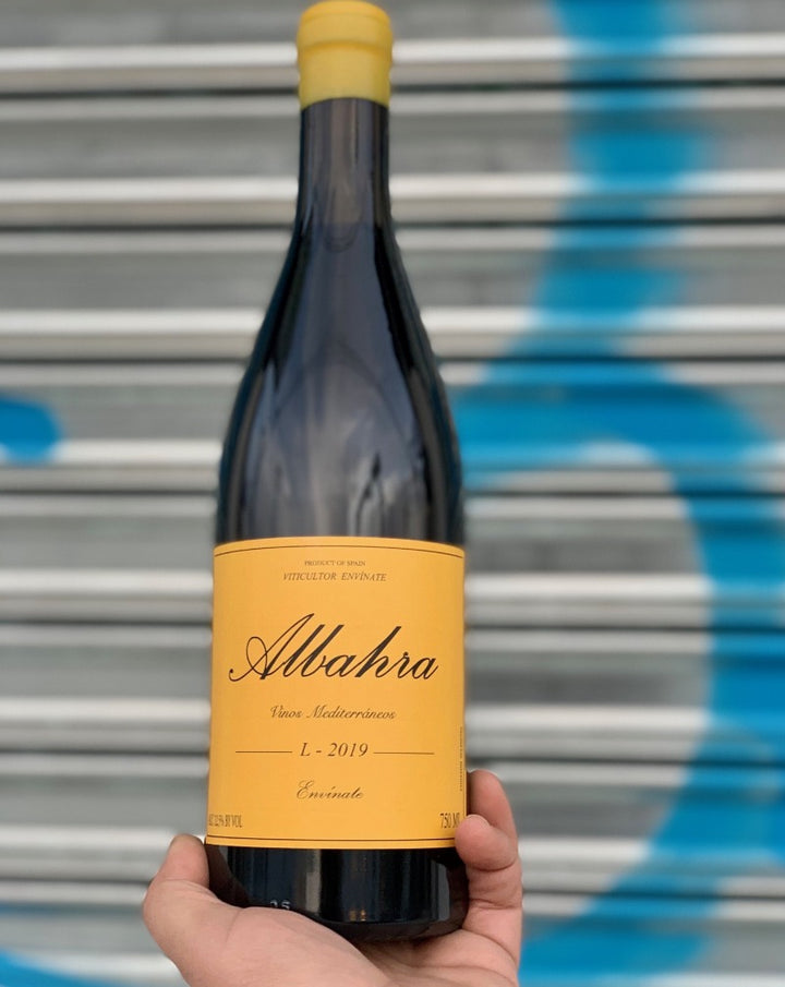 Grenacha Tintorea. Canary Islands, Spain.  Woman winemaker - Laura Ramos. All natural. Super allocated + low production. Savory + succulent. WILF - Wine I'd like to F##k Rich + juicy with banging acidity. Pepper + plums Wispy tannins.