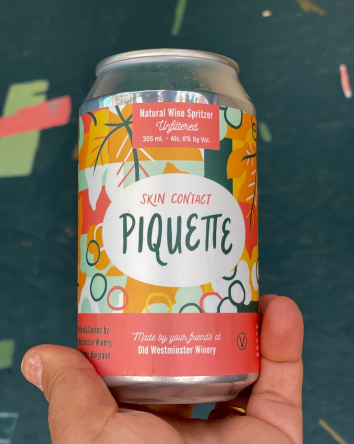 100% Orange Piquette. Westminster, Maryland  Woman winemaker - Lisa Hinton. All natural. Orange wine. Spritzy and fresh pink star-bursts with a tickle of white sage. Grapefruit fizz. Earthy dry kick. Green almonds. 1 can = 1/2 a bottle!