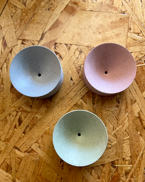 Assorted concrete simple incense holders. 2 x 1 inches. Made in United States of America. Incense sold separately. Choose from green, blue or pink.