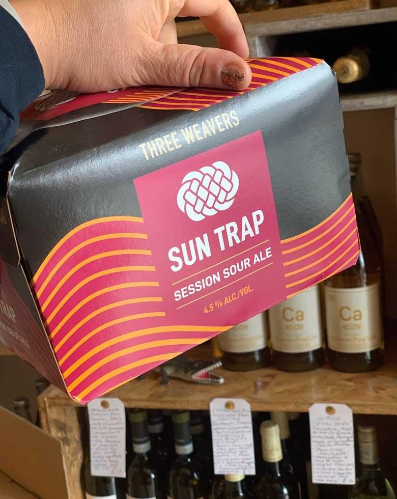 Three Weavers Sun Trap Sour Inglewood, California.  Woman brewer - Alexandra Nowell. Session sour. Refreshing orbit. Sour fermented with passionfruit. Finished with Mendocino sea salt and lemon peel.