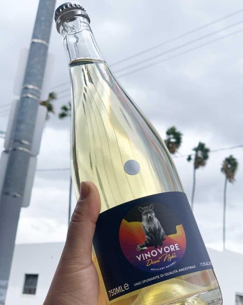 100% Famoso. Emilia-Romagna, Italy.  Woman in wine - Coly Den Haan. All natural. Pet-Nat (bubbles). Dry orange dreamsicle. Super salty, a little creamy, and all dreamy. Granny Smith apples + sage.