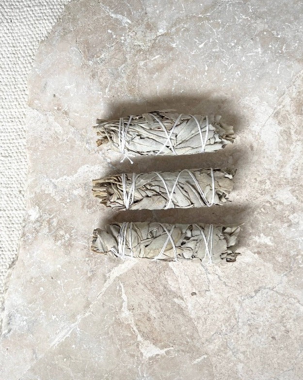 Ethically sourced California white sage. Sage is traditionally burned ceremonially in purification rituals. It can clear a physical or mental space of stagnant or negative energy.  Smudge sticks are about four inches long and are hand tied with cotton string.